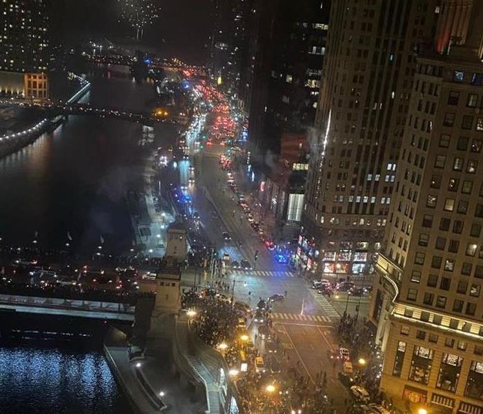 Downtown Chicago at night with fireworks exploding in the distance